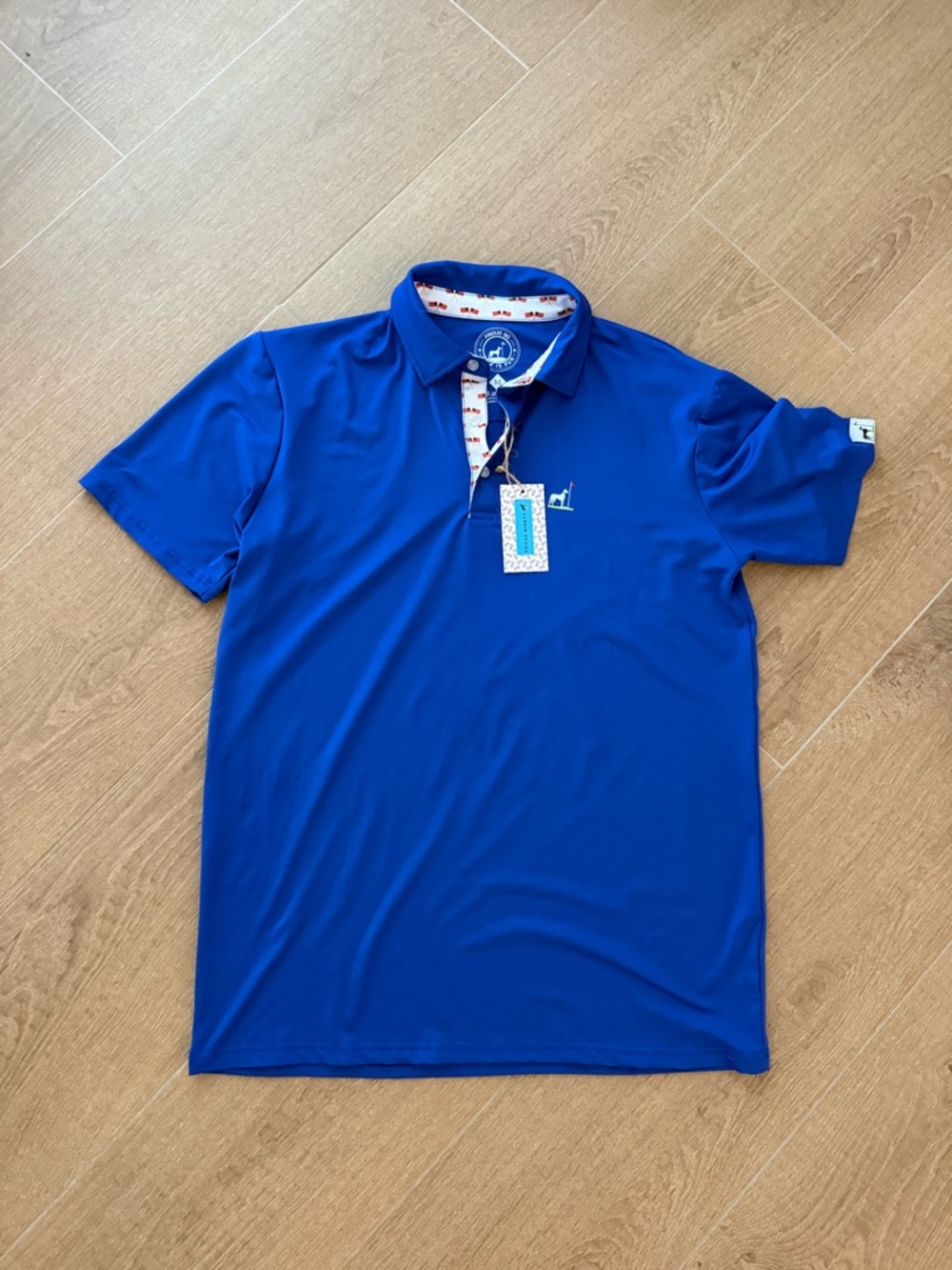 Proud Ninety royal blue golf polo with American Flag detail
